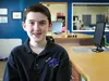 Tobin Hushower poses for a photo in the Rent-A-Geek shop in June. The 13-year-old soon-to-be freshman at Palmer High School designs and builds custom Minecraft video game worlds for competiti