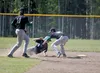 Colony infielder Robert Cottingham tags Palmer's Wyatt Shults before Shults gets back to second base during Colony's 17-11 win over the Moose in an elimination game in the Southcentral Confer