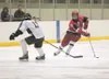 Wasilla senior Chancie Hanson moves the puck past Colony’s
Anthony Kolendo during the Warriors’ 3-2 win last weekend at the
Curtis C. Menard II Memorial Ice Arena in Wasilla. ROBERT DeBERRY/F