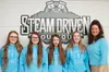 Wasilla Middle School National Junior Honor Society members Amber Prosser, Madison Ressler, Autumn Johnson and Kennedie Goulding pose for a photo with MY House founder and Executive Director 