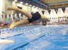 ROBERT DeBERRY/Frontiersman Palmer senior Spencer Bloom dives
off the starting block during the 200-yard freestyle relay at the
Palmer Invite. The Region III Swimming and Diving Championships