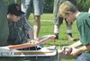 Truitt Martin and Paul Hosier get ready to start the plane with
the electric starter, which grips the nose of the plane and quickly
turns, causing the engine to start. The Houston High School