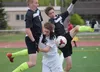 Colony's Cade Johnstone (8) and Michael Sliwa (5) collide in the goal box with Soldotna's Eli Sheridan, Friday at Ed Hollier Field in Kenai. Photo by Joey Klecka/Peninsula Clarion