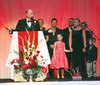 Gov. Bill Walker his wife, Donna, and members of their family join the governor on stage Feb. 6, 2015, during the Mat-Su Inaugural Ball at the Curtis D. Menard Memorial Sports Center in Wasil