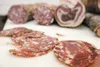 A variety of cured meats sit cut and ready to sample during a
cooking session in preparations for the Made in Alaska Taste Fest
Saturday at the Palmer Train Depot. (ROBERT
DeBERRY/Frontiersma