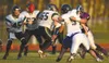 John Wagner/Fairbanks Daily News-Miner Colony quarterback
Anthony Bricker (5) pitches a quick shovel pass to running back
Skye Rench, left, moments before getting wrapped up by Lathrop
defens