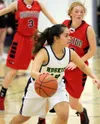 Redington senior Kiana McGovern brings the ball across the floor during a 50-41 win over Houston Tuesday at Redington. The Huskies hosted their first basketball senior night and swept the Haw