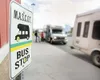 ROBERT DeBERRY/Frontiersman Two Mat-Su Community Transit buses
sit at the Wal-Mart bus stop Thursday afternoon. The transit group
called MASCOT provides bus service as far north as Houston,
c