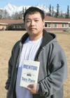 Palmer Alaska Job Corps Center alumnus Chao Her holds a copy of
the book “Mentor—The Kid and the CEO,” by author Tom Pace. Pace
will speak at the center at 8:30 a.m., Thursday. Photo courtesy