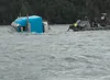 Recovery crews attempt to attach a tow cable to a 2012 Freightliner tractor submerged in the Matanuska River on Sunday, Aug. 13. According to Alaska State Troopers, the truck’s driver was for