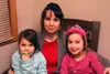 Elizabeth Slipher smiles for a photo with her daughters, Bethany (4) — who loves broccoli — and Lucy (8) in her new home. The Sliphers recently 'graduated' from Family Promise's homeless prev