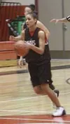 Trista White brings the ball down the court for the Warriors in
the Wasilla Jamboree on Friday. White, a transfer from Lathrop, is
penciled in to be the Warriors' starting point guard. Photo 