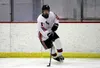 Houston defenseman Noah Gillespie skates the puck away from the boads during a game against Monroe Catholic last season. Gillespie is among Houston's top three defensemen this season. Courtes