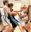 Palmer junior Caitlin Scott (14) and senior Anna Koehn (21) try to take the ball away from Soldotna’s Julie Litchfield during a quarterfinal game of the Northern Lights Conference Championshi