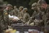 Soldiers in initial military training at Fort Jackson, S. C., line up to eat, May 11, 2020. (Victoria Evans)