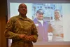 Chief Warrant Officer 5 Phillip Brashear, 80th Training Command, shows a photo of his father with Cuba Gooding Jr. The actor played his father in the movie Men of Honor, which was released in