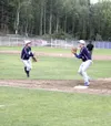 JEREMIAH BARTZ/Frontiersman Alaska Road Warriors pitcher Dominic
Comerate, left, flips the ball to first baseman Dusty Wisdom during
a loss to the Las Vegas Lions on Saturday. The Warriors re