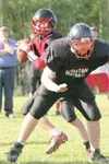 ROBERT DeBERRY/Frontiersman Houston quarterback Beau Frank looks
for an open receiver as center Todd Lee provides protection during
practice Thursday afternoon at Houston High School. The Haw