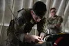 U.S. Army Sgt. Nathan Kelley, assigned to the 2nd Brigade, 11th Airborne Division, completes multiple medical assessments during the second day of the Best Medic Competition on Joint Base Elm