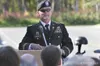 Maj. Mark Melson speaks during the dedication ceremony Sunday.
He was instrumental in helping the Hemenway family find a permanent
home for the Battlefield Cross Memorial in Alaska. The memor