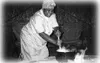 A South African woman makes "mealy-pap," a staple food among the
natives. According to author Frederic Brown, Ingwe is one of the
few places a person can travel and enjoy such remarkable peop
