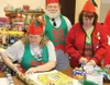 Three of Santa’s elves, help wrap presents at Santa’s Workshop
on Saturday. They are, from left, Susan Sprague, Dean Backen and
Theresa Page. (GREG JOHNSON/Frontiersman)