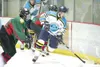 ROBERT DeBERRY/Frontiersman Alaska Avalanche forward Robb Haider
moves the puck out of the corner during Friday's game against the
Kenai River Brown Bears at the Curtis C. Menard II Memorial 