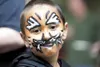 Brandon Bahr, 6, shows off his tiger face paint at Halloween
Hollow Monday evening. The Halloween event is a benefit for Mat-Su
Special Santa and Toys for Tots. This is the 10th year for this