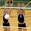 Colony hitters Amanda Aafedt and Rochelle Ray leap for a block
during the Knights' 3-2 win over Palmer at Colony High School last
week. Photo by JEREMIAH BARTZ/ Frontiersman.