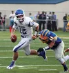 Palmer quarterback Clayton Southwick tries to scramble away from the pressure of a Bartlett High player earlier this season. Last week, Southwick threw two touchdown passes against Soldotna. 