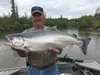Mike Sims displays a coho salmon during a recent season. Courtesy of Andy Couch