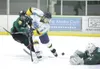 ROBERT DeBERRY/Frontiersman Alaska forward Zach Smith takes a
shot on goal during a 4-3 win over the Kenai River Brown Bears on
Thursday at the Curtis C. Menard II Memorial Ice Arena in
Wasil