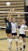 Alyson Boyd leaps to redirect a Bartlett hit in the second game
of their loss against the Golden Bears Saturday. JEREMIAH BARTZ/
Frontiersman.