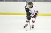 Houston junior forward Jon Lovelace moves the puck across the ice during the Hawks game against the Wasilla Warriors at the Curtis C. Menard II Memorial Hockey Tournament in Wasilla. ROBERT D