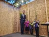 Rabbi Mendy Greenberg stands inside a homemade Sukkot with his children Chana, Ari, and Levi. Jacob Mann/Frontiersman