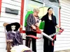 Black Birch Books owner Taylor Jordan cuts the ceremonial ribbon with Wasilla Mayor Glenda Ledford during the grand reopening ceremony for the new Bogard location. Courtesy photo