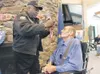 ROBERT DeBERRY/Frontiersman Veterans Aviation Outreach founder
Maurice Bailey, left, presents an Alaska Honorable Service Medal to
Robert Mielke during a ceremony Friday at the Alaska Veteran