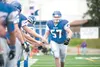 Palmer senior Cole Frohling runs down the sideline as he’s being introduced prior to a recent home game. Frohling has been named the Railbelt Conference Lineman of the Year. ROBERT DEBERRY/Fr