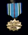 U.S. Air Force Col. Travolis A. Simmons, the commander of the 3rd Wing, awards Joint Service Achievement Medals to Airmen from the 3rd Maintenance Squadron for their participation in the reco