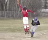 Palmer’s Augustus Topp crosses home plate safely as Wasilla
catcher Ben Fielder leaps for the ball during the Warriors’ 26-23
win over Palmer on Wednesday. (JEREMIAH BARTZ/Frontiersman)