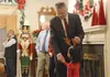 Gov. Mike Dunleavy greets a child during the governor’s annual holiday open house Dec.12, 2022, at the Governor’s Mansion in Juneau. James Brooks/Alaska Beacon