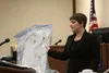 Prosecutor Lindsey Burton holds up the shirt Jamie R. Smith, 20, wore the night authorities say he severely beat Savannah Simpson. Attorneys delivered closing arguments in the trial Friday af