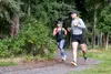 Runners round a corner during a Women’s Equality Day 5K at Joint Base Elmendorf-Richardson, Alaska, Aug. 26, 2021. JBER hosted events across the installation to celebrate women in the militar