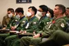 Service members from U.S. Air Force and Japan Self-Air Defense Force listen to the Deployed Forces Commander, Col. Brian Cusson, to kick-off RED FLAG-Alaska 21-2 at Joint Base Elmendorf-Richa