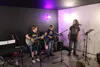 Fireweed Music Camp students perform with local musician Aaron Peatross at Wood and Wire Guitars and Music. Jacob Mann/Frontiersman