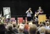 Rose Alm and Duane Guisinger perform for family and friends gathered at a memorial service for two-time Wasilla mayor Harold Sherwood Newcomb at the Curtis D. Menard Memorial Sports Center in