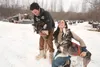 Nicolas Petit and Laura Allaway with their lead dogs Thursday afternoon at the Redington dog yard off Knik-Goose Bay Road. Both Petit and Allaway are entered in this weekend’s Northern Lights
