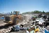 A large front-end loader pushes trash at the construction and demolition pit at the Mat-Su Borough Central Landfill off 49th State Street. Landfill rates increased July 1. Frontiersman file p