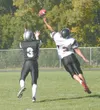 Nikiski lineman Elliot Tuttle tries to chase down Houston senior
running back Brandon Parks during the Bulldogs’ 23-20 win over the
Hawks Saturday at Houston High School. Nikiski was able to 