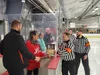 Diane Firmani receives a memorial plaque that will be hung up inside "The Hammer's Room" for coaches and staff at Brett Memorial Ice Arena. Jacob Mann/Frontiersman